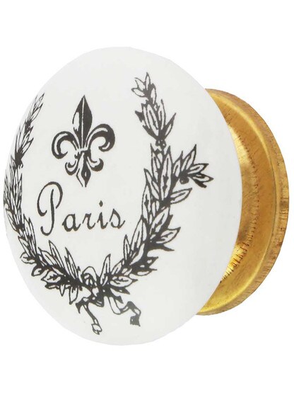 White Porcelain Paris Fleur-De-Lis Cabinet Knob with Brass Base in Un-Lacquered Brass.